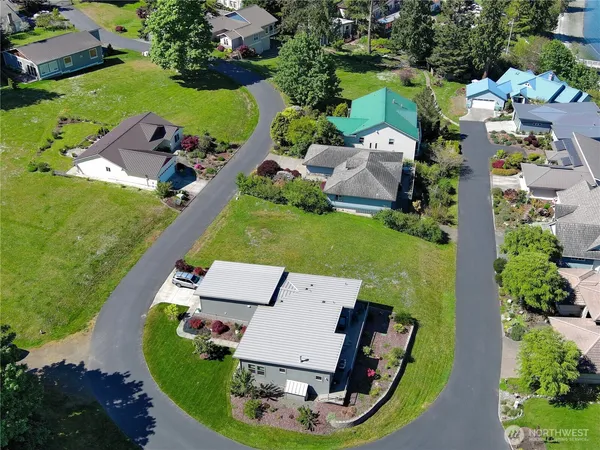 an aerial view of a house with outdoor space pool seating area and yard