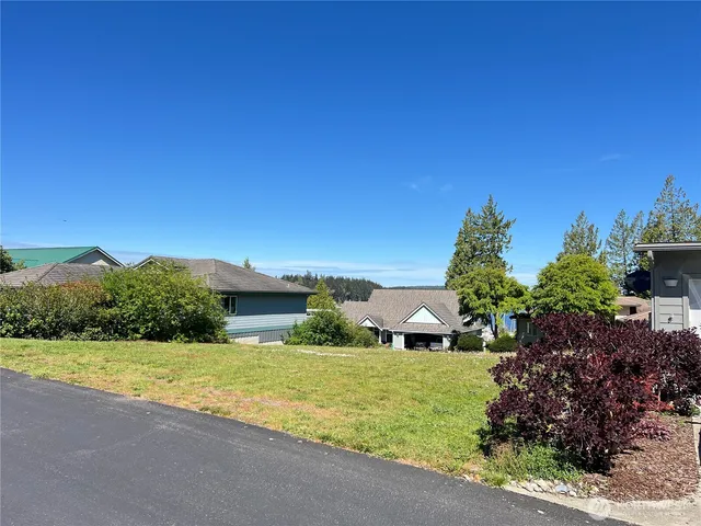 a view of a garden with a building in the background