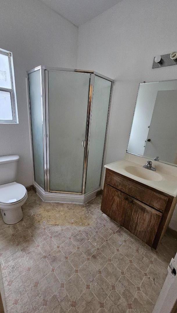 371 East William Street San Jose, CA 95112 - Photo 6 of 9 a bathroom with a sink a toilet a mirror and shower