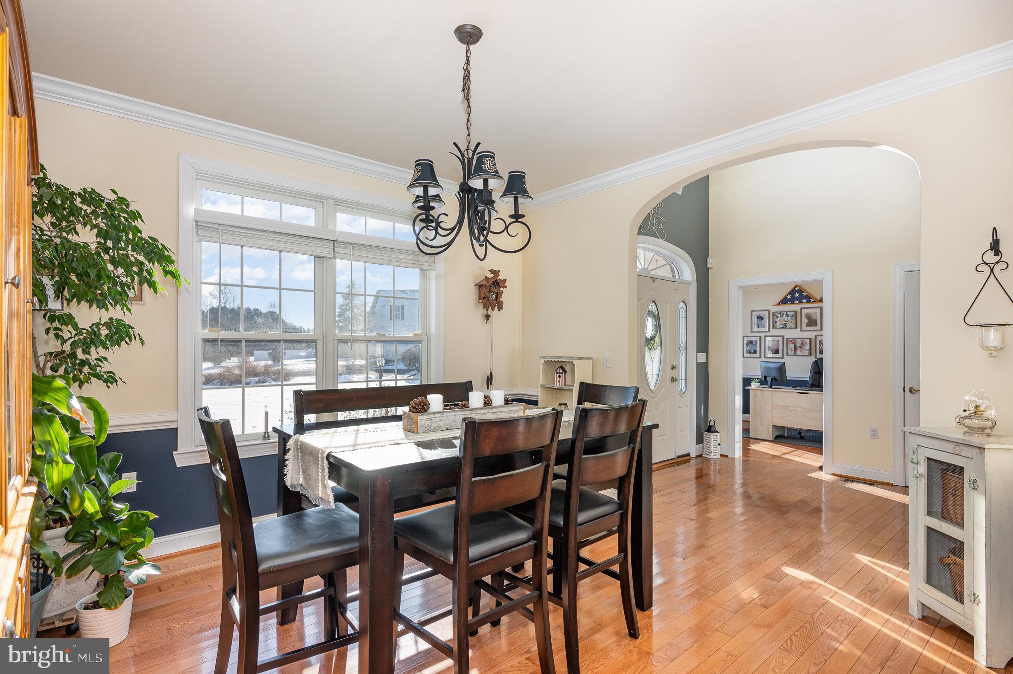 8291 Clearfield Road Denton, MD 21629 - Photo 14 of 40 a view of a dining room with furniture window and wooden floor