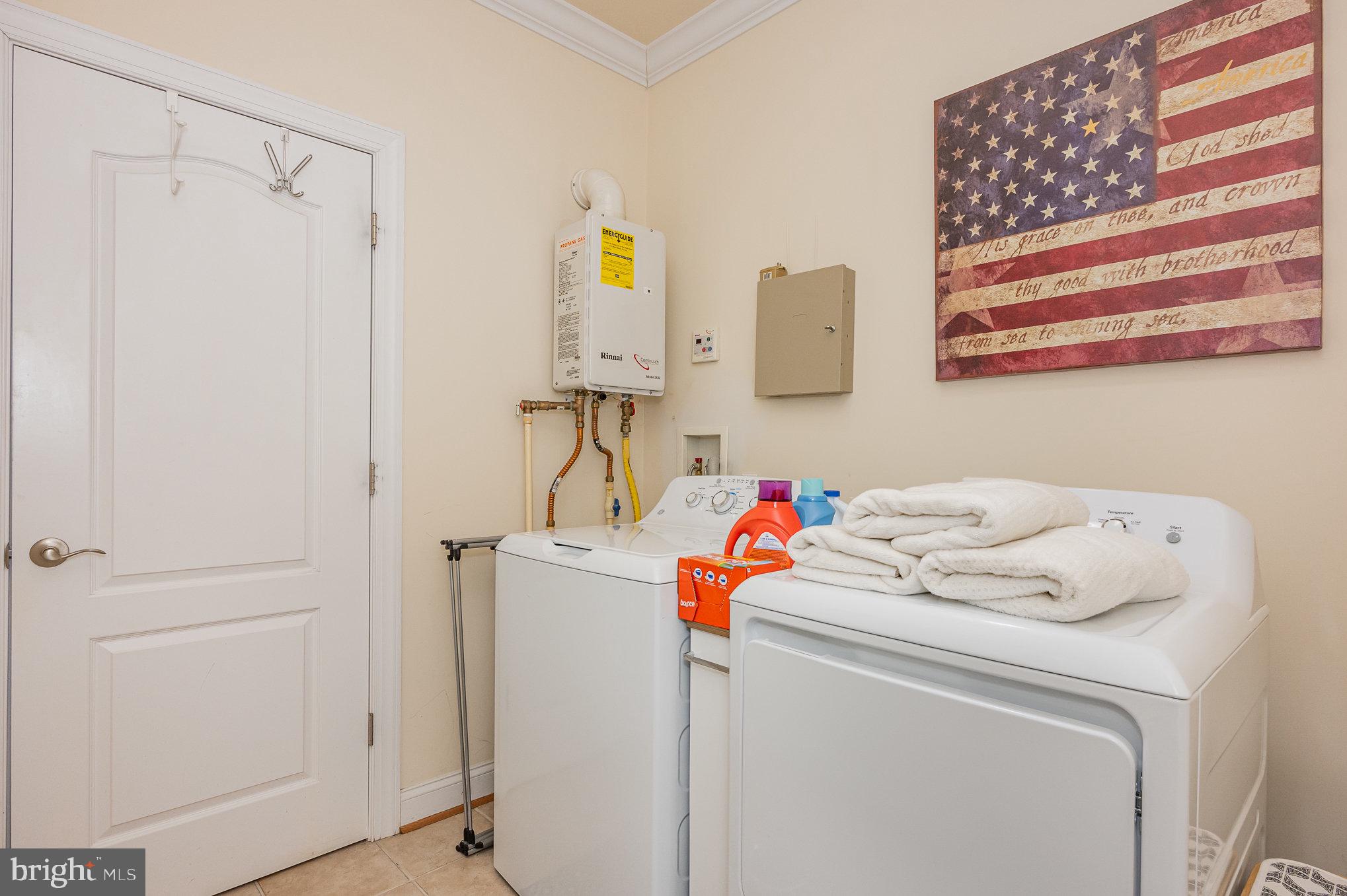8291 Clearfield Road Denton, MD 21629 - Photo 24 of 40 a utility room with dryer and washer