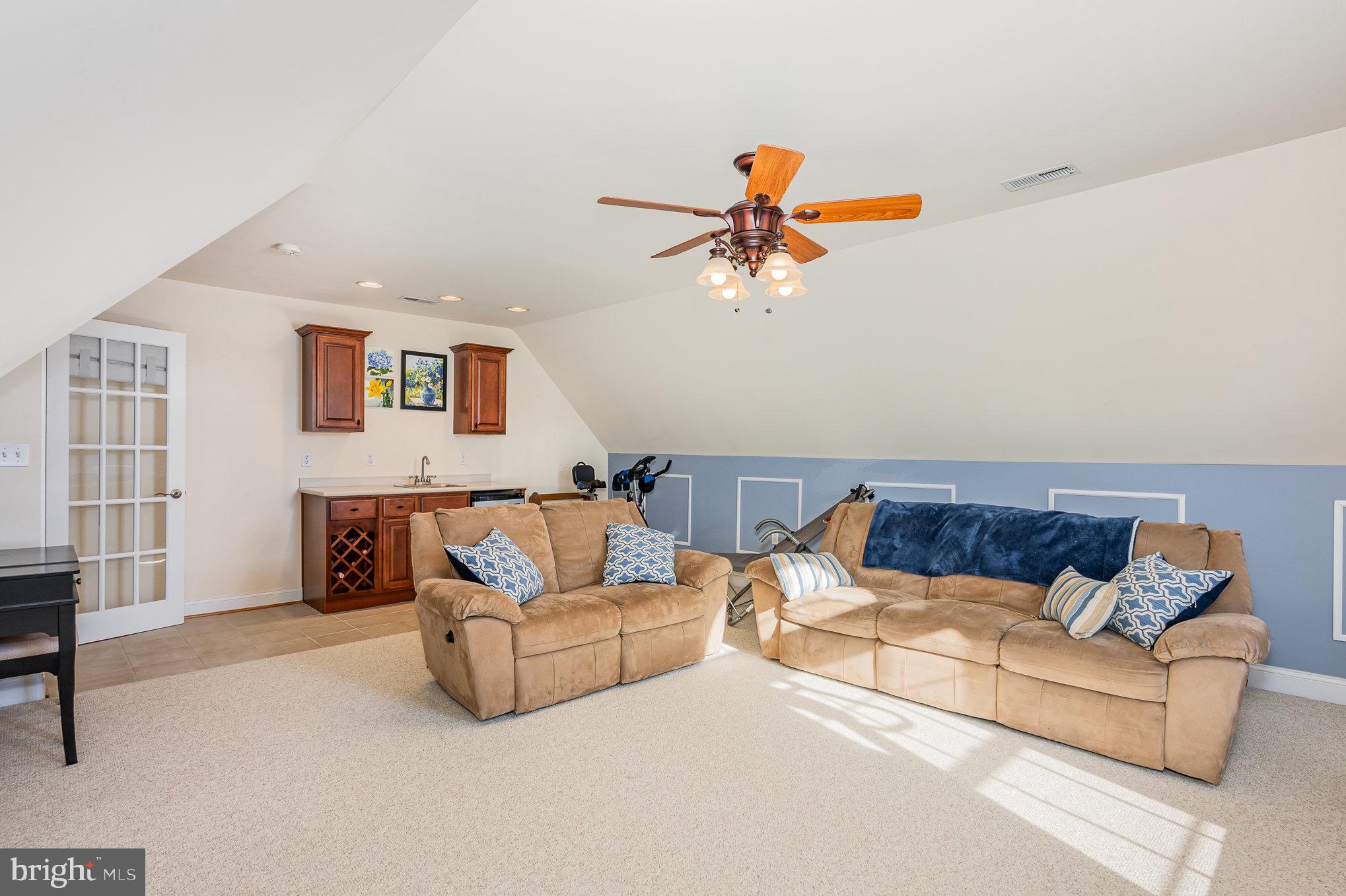 8291 Clearfield Road Denton, MD 21629 - Photo 27 of 40 a living room with furniture and a couch