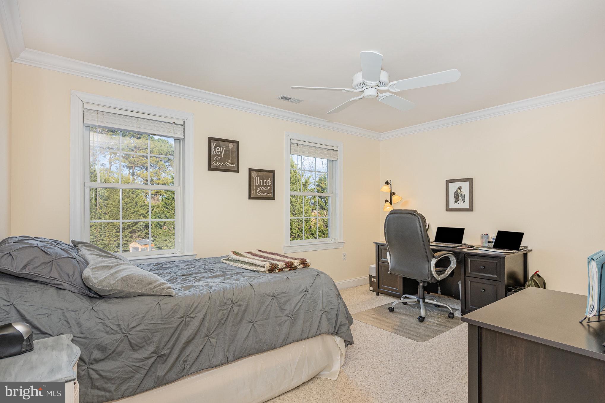 8291 Clearfield Road Denton, MD 21629 - Photo 30 of 40 a bedroom with a bed and wooden floor