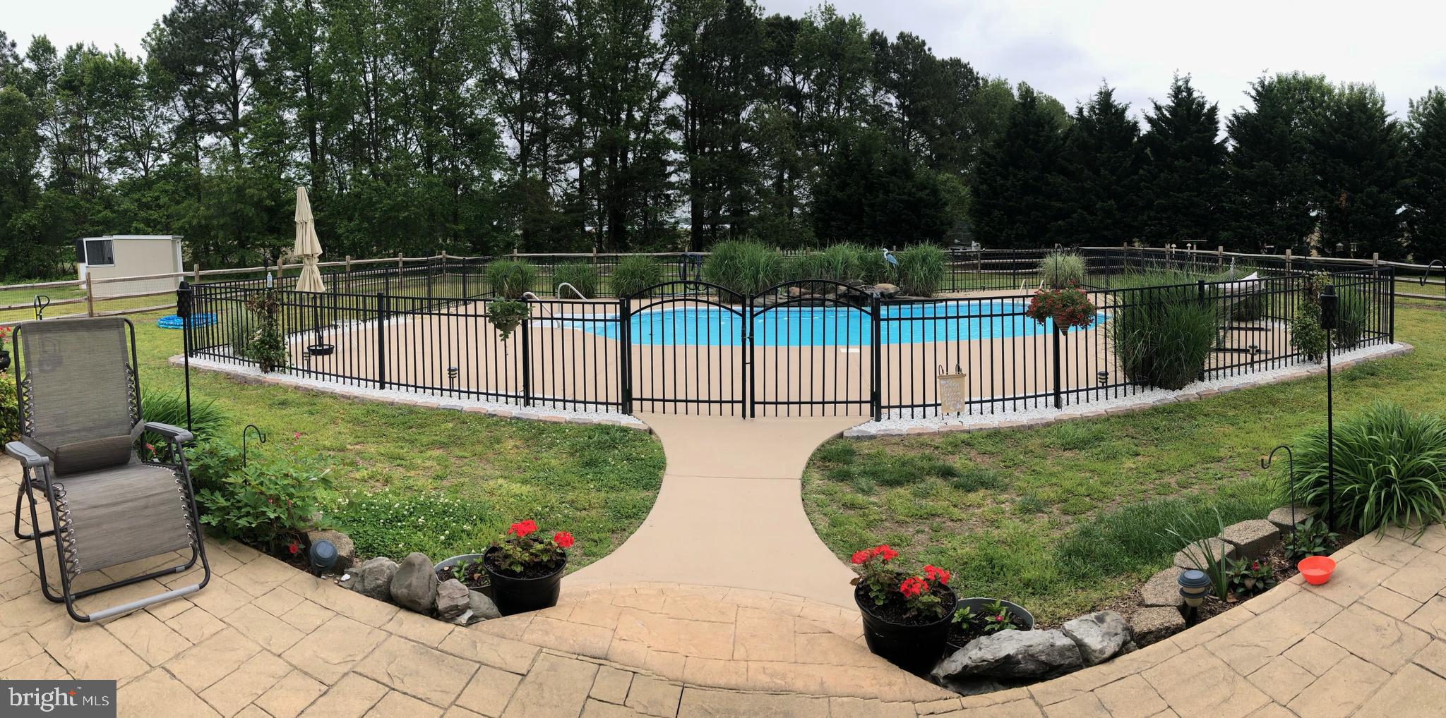 8291 Clearfield Road Denton, MD 21629 - Photo 3 of 40 a view of a garden with sitting area