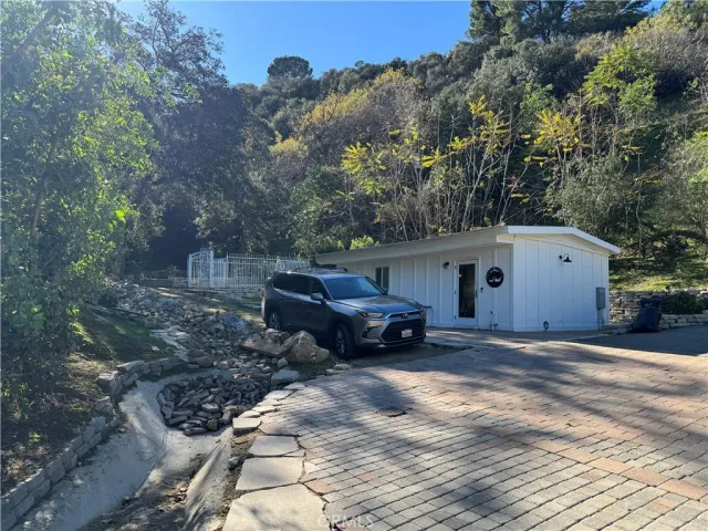 a view of house with backyard