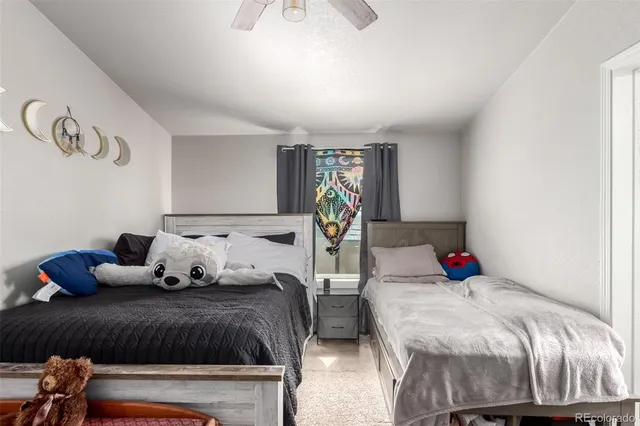 a bedroom with a bed and dresser