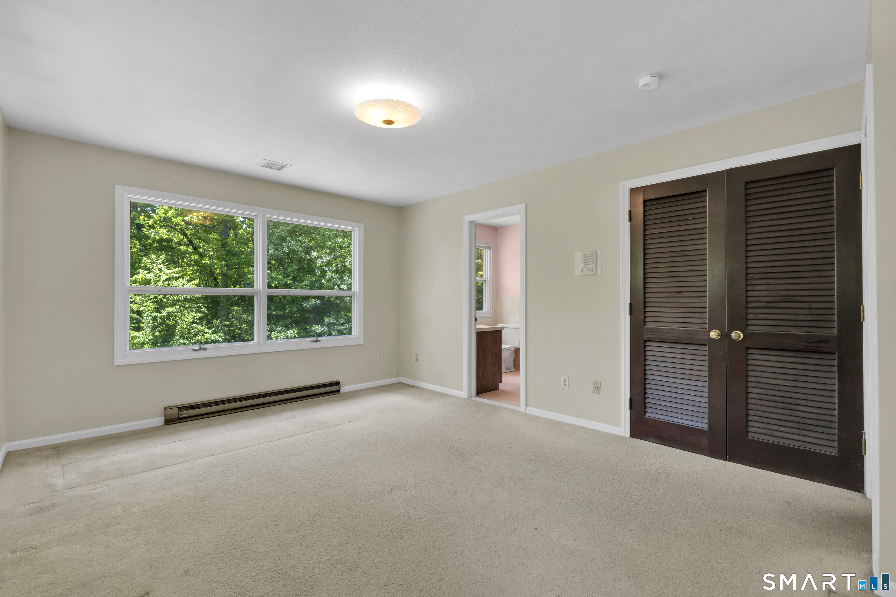 30 Maltbie Road Newtown, CT 06470 - Photo 27 of 40 a view of an empty room with a window