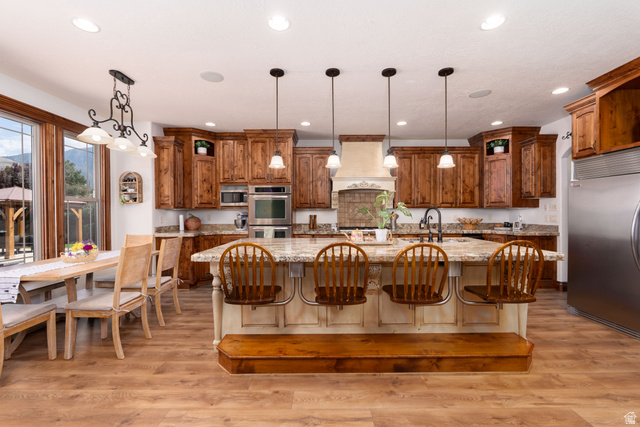 687 South 2080th Street East Springville, UT 84663 - Photo 3 of 149 Kitchen featuring wood-finish flooring and extensive cabinetry