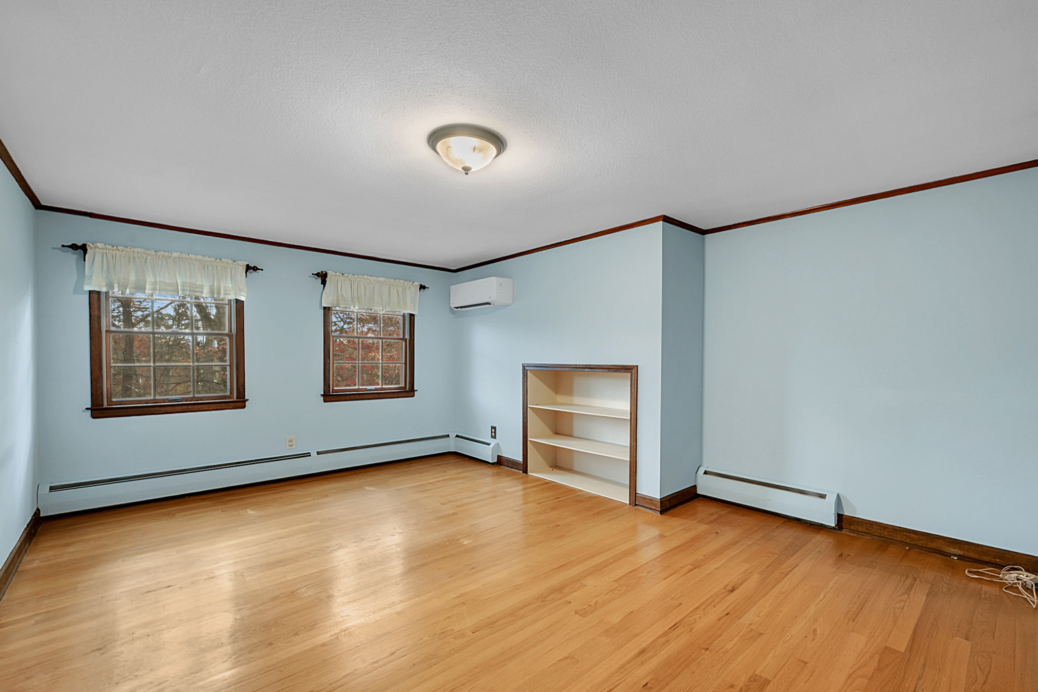 15 Jan Road Bristol, CT 06010 - Photo 16 of 27 an empty room with wooden floor and windows