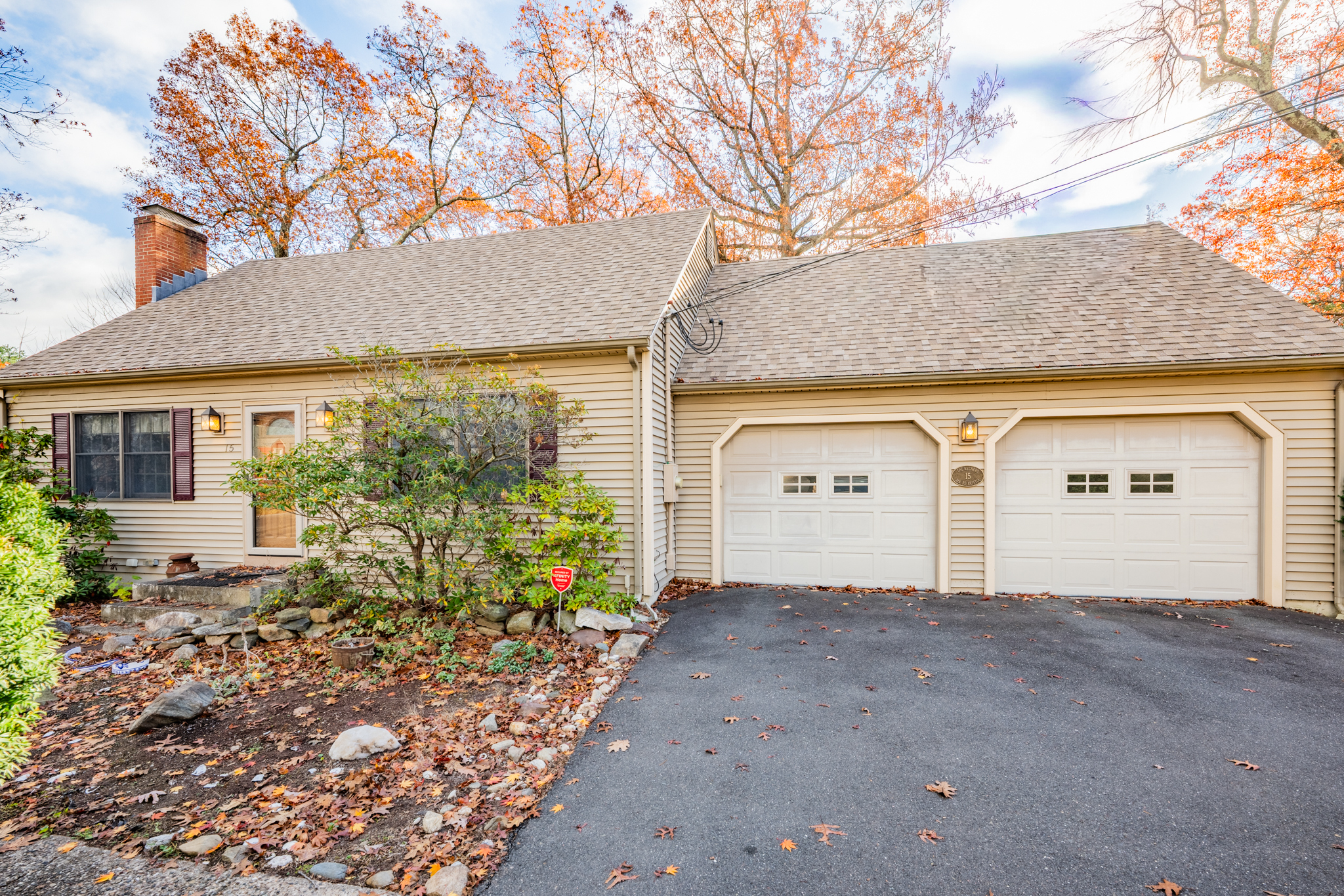 15 Jan Road Bristol, CT 06010 - Photo 2 of 27 a front view of a house with a yard and garage