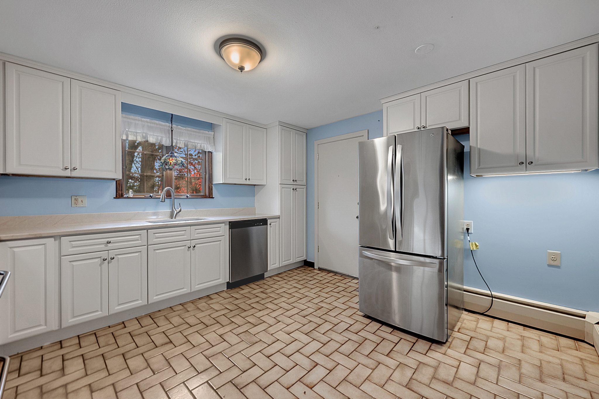 15 Jan Road Bristol, CT 06010 - Photo 3 of 27 a kitchen with a refrigerator and a sink