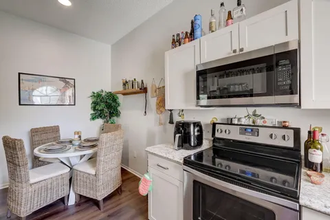 a kitchen with a stove and a microwave
