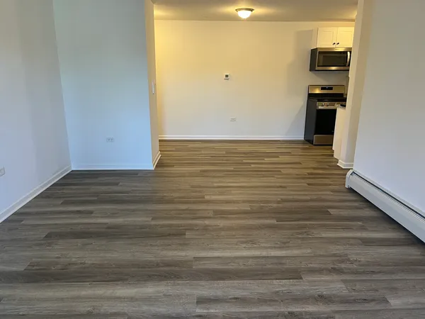 a view of a floor to ceiling room with wooden floor