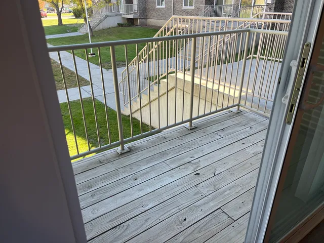a view of a balcony with a floor to ceiling window