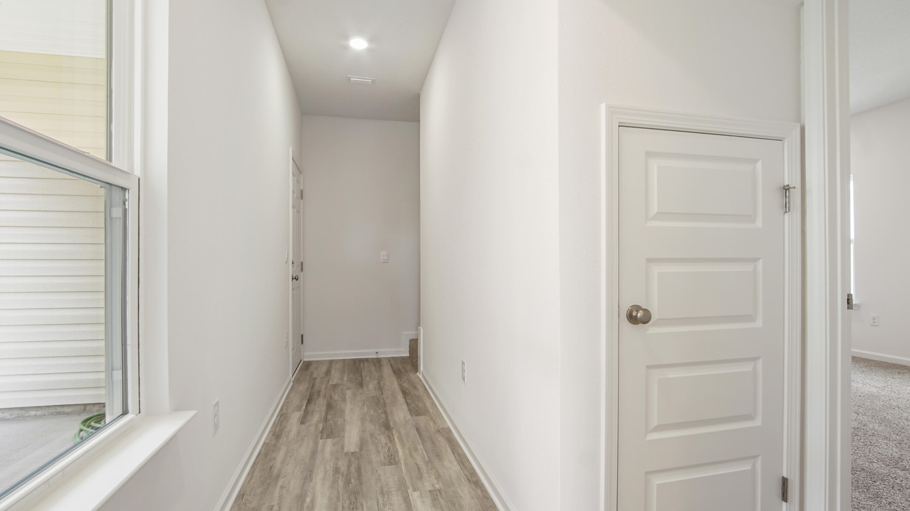 206 Huckleberry Street Freeport, FL 32439 - Photo 17 of 36 a view of a room with wooden floor