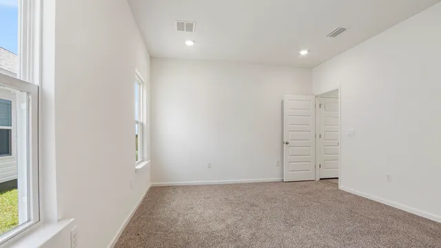 an empty room with windows