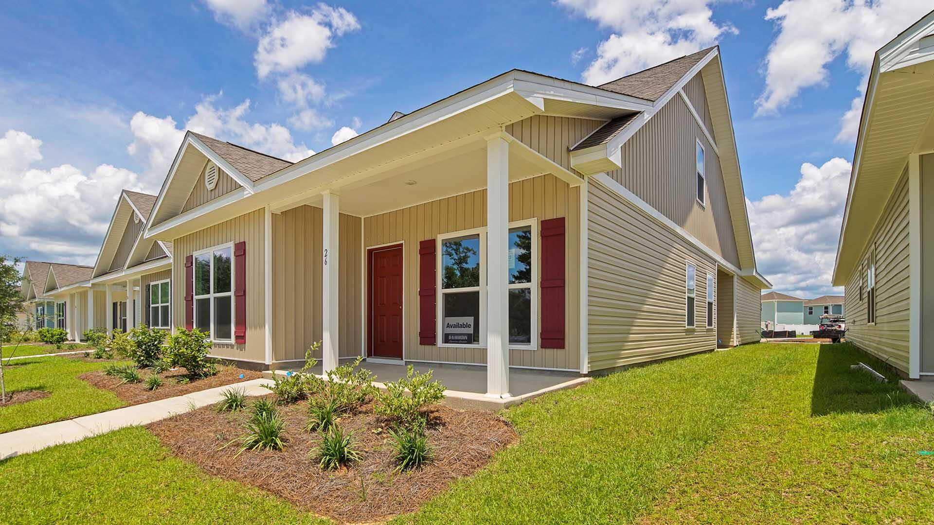 206 Huckleberry Street Freeport, FL 32439 - Photo 3 of 36 a view of a house with yard and deck