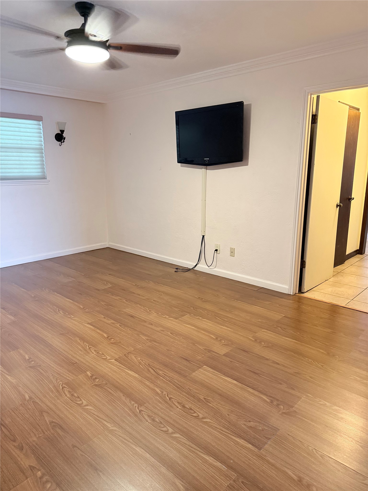 3802 Midforest Drive Houston, TX 77068 - Photo 11 of 31 an empty room with wooden floor and windows