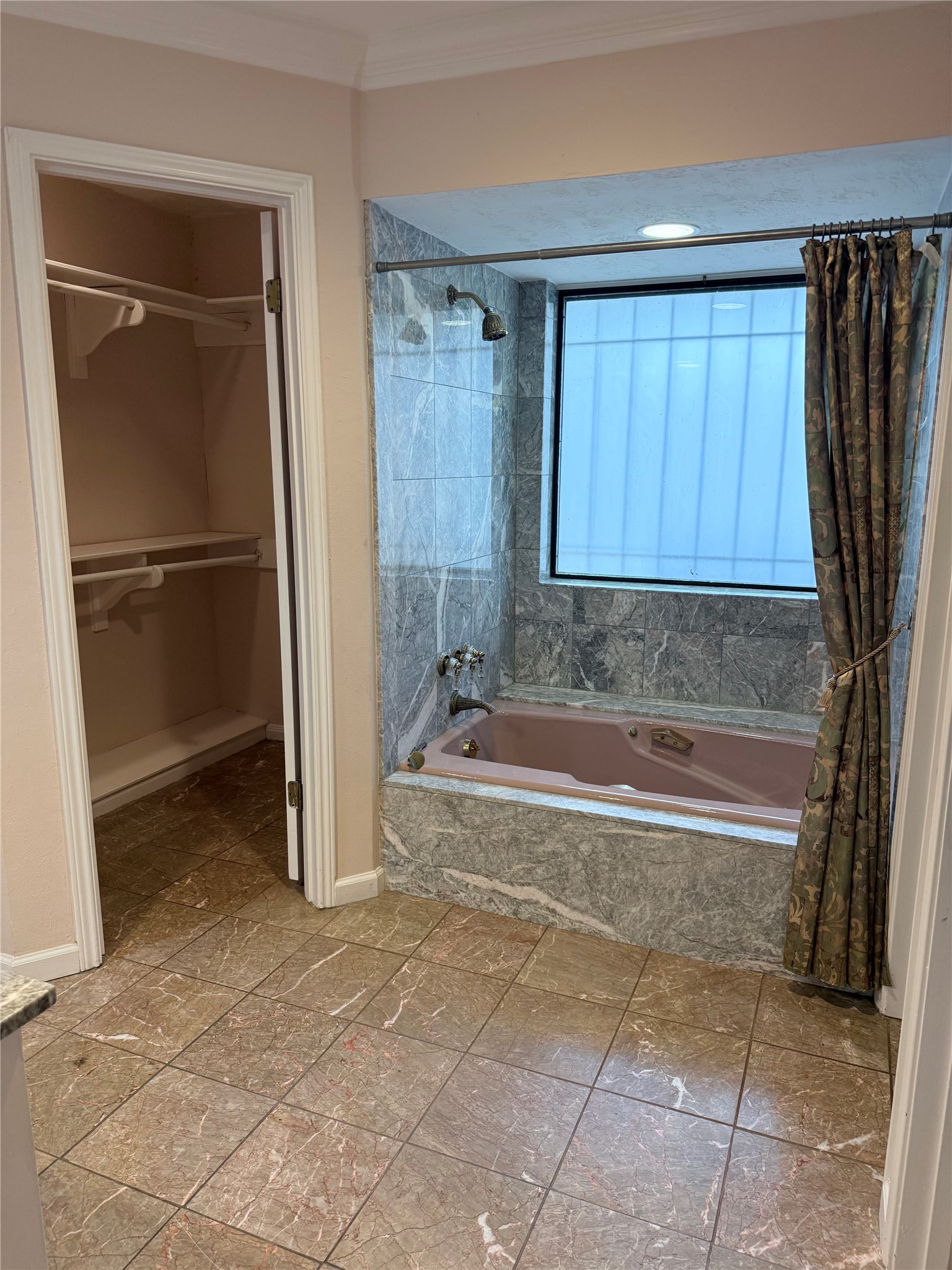 3802 Midforest Drive Houston, TX 77068 - Photo 13 of 31 a bathroom with a tub shower and cabinets