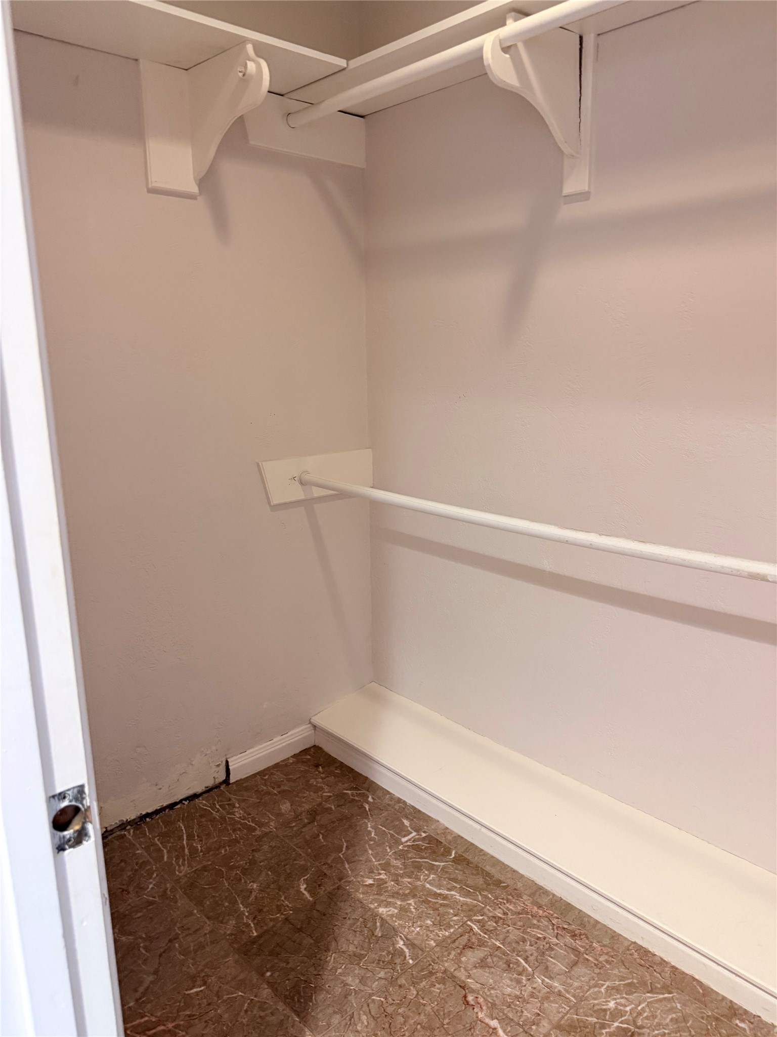 3802 Midforest Drive Houston, TX 77068 - Photo 17 of 31 a view of a room with racks on the wall