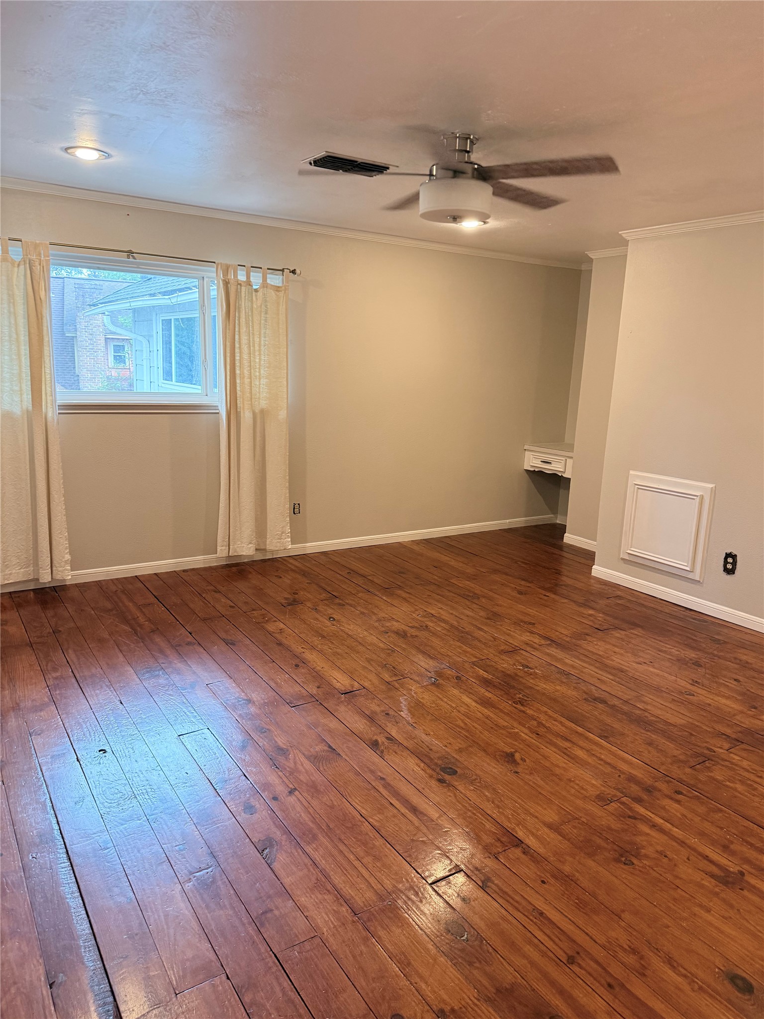 3802 Midforest Drive Houston, TX 77068 - Photo 23 of 31 an empty room with wooden floor and windows
