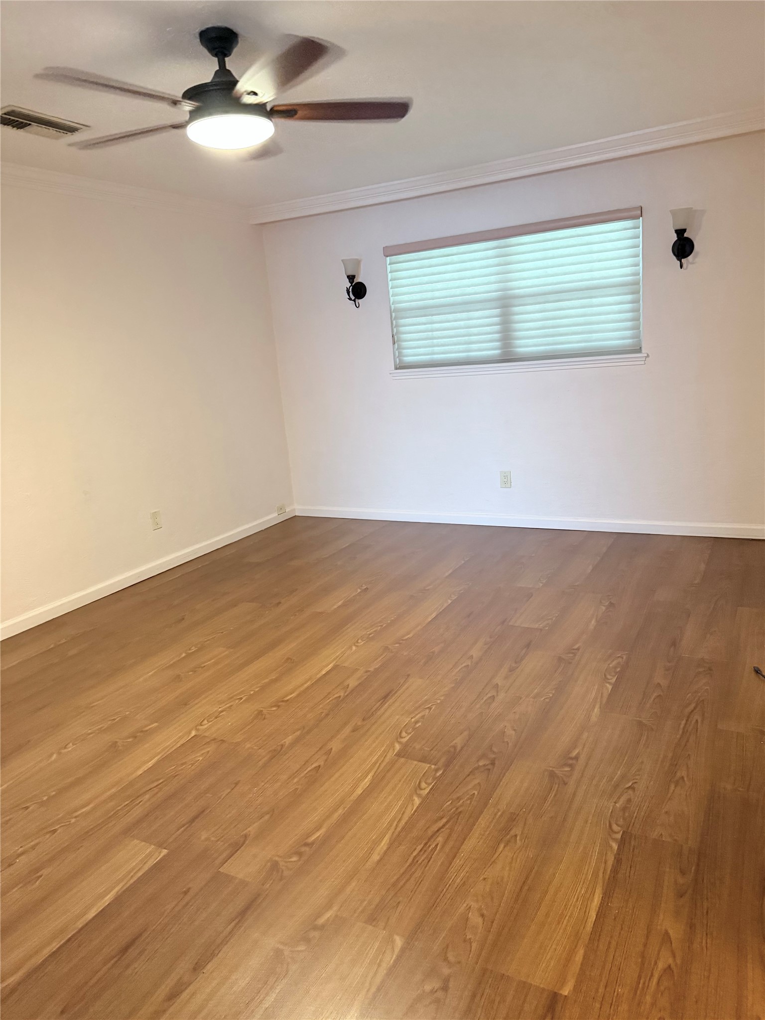 3802 Midforest Drive Houston, TX 77068 - Photo 24 of 31 an empty room with wooden floor and windows