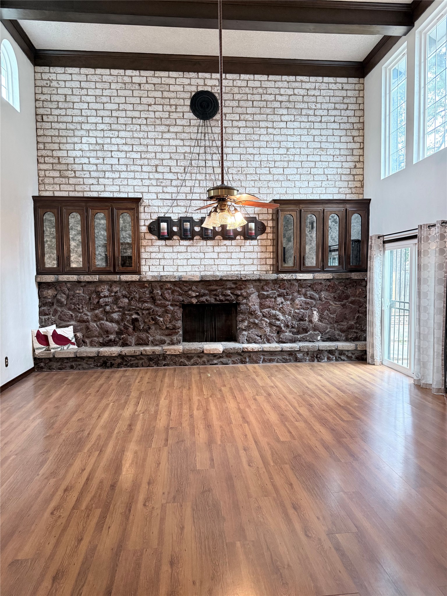 3802 Midforest Drive Houston, TX 77068 - Photo 7 of 31 a living room with stainless steel appliances wooden floor and a fireplace