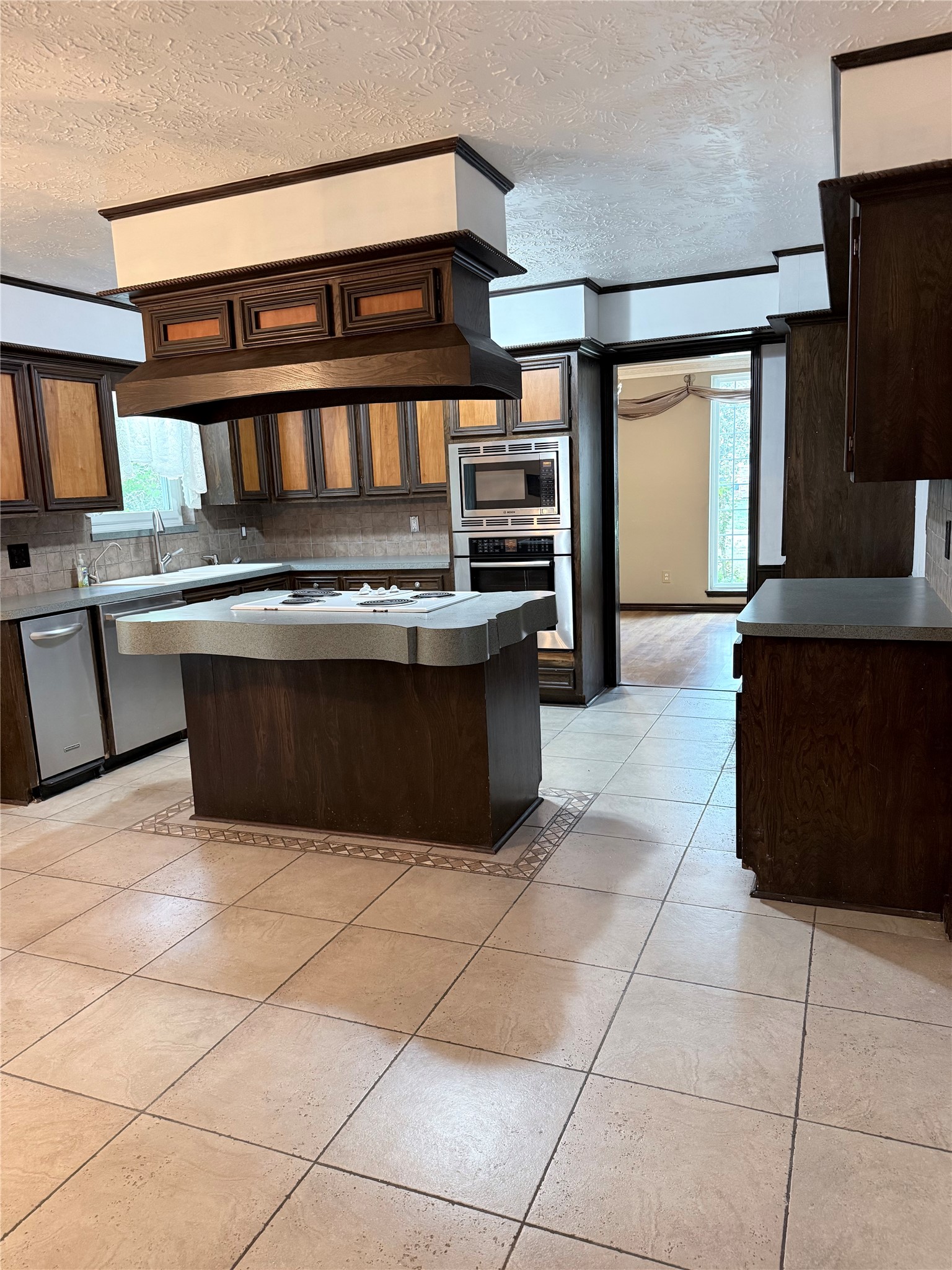 3802 Midforest Drive Houston, TX 77068 - Photo 10 of 31 a kitchen with stainless steel appliances granite countertop a stove and a refrigerator