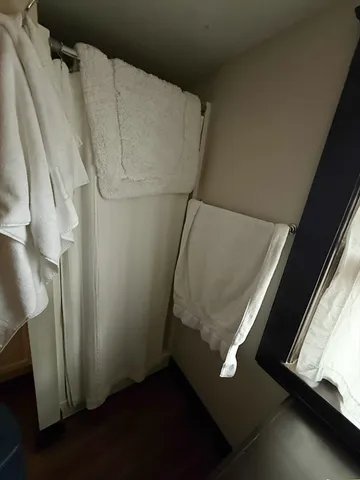 a view front of house with window and trees in the background