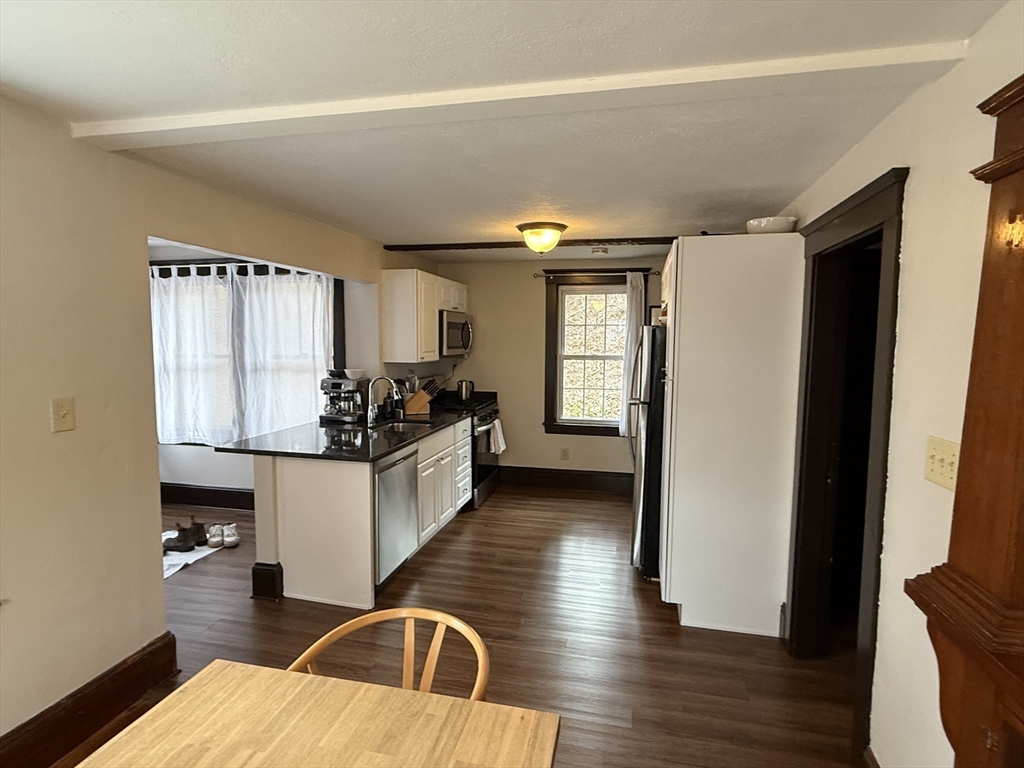 27 Breakneck Hill Road, Unit 27 Southborough, MA 01772 - Photo 8 of 25 a kitchen with sink refrigerator and window