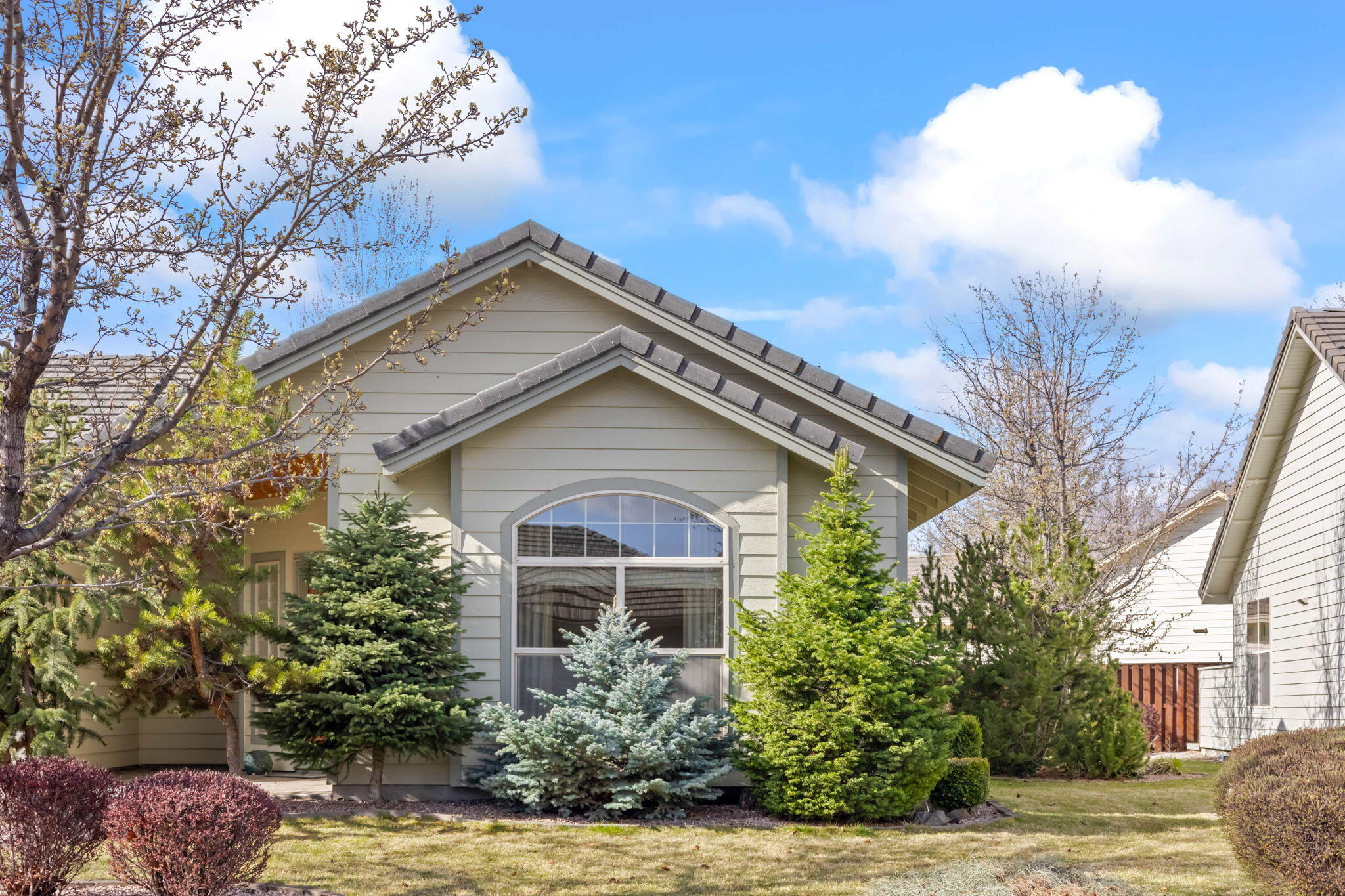 1726 Northwest Cliffside Way Redmond, OR 97756 - Photo 1 of 36 a front view of a house with a yard