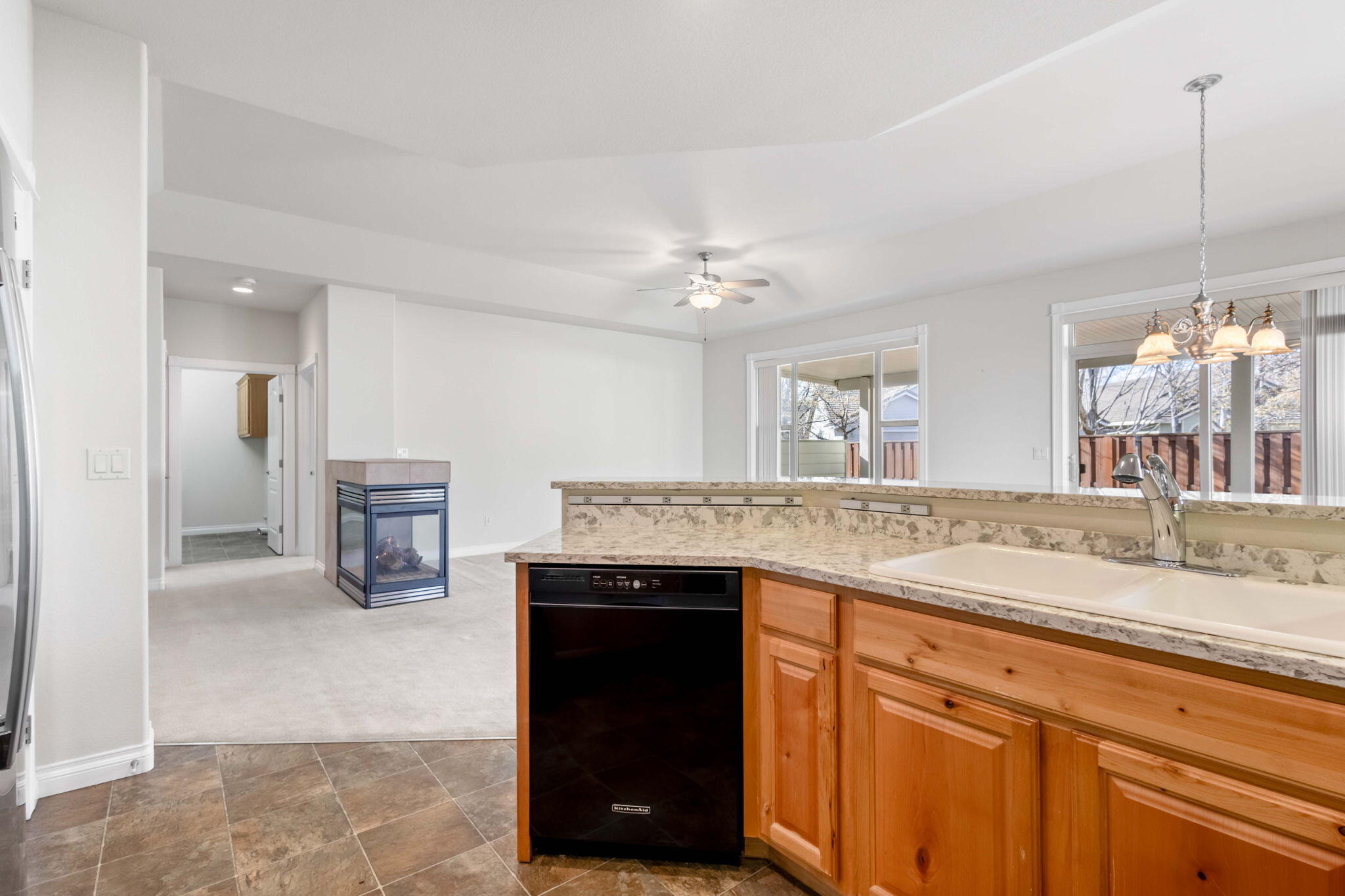 1726 Northwest Cliffside Way Redmond, OR 97756 - Photo 14 of 36 a kitchen with a sink and a refrigerator