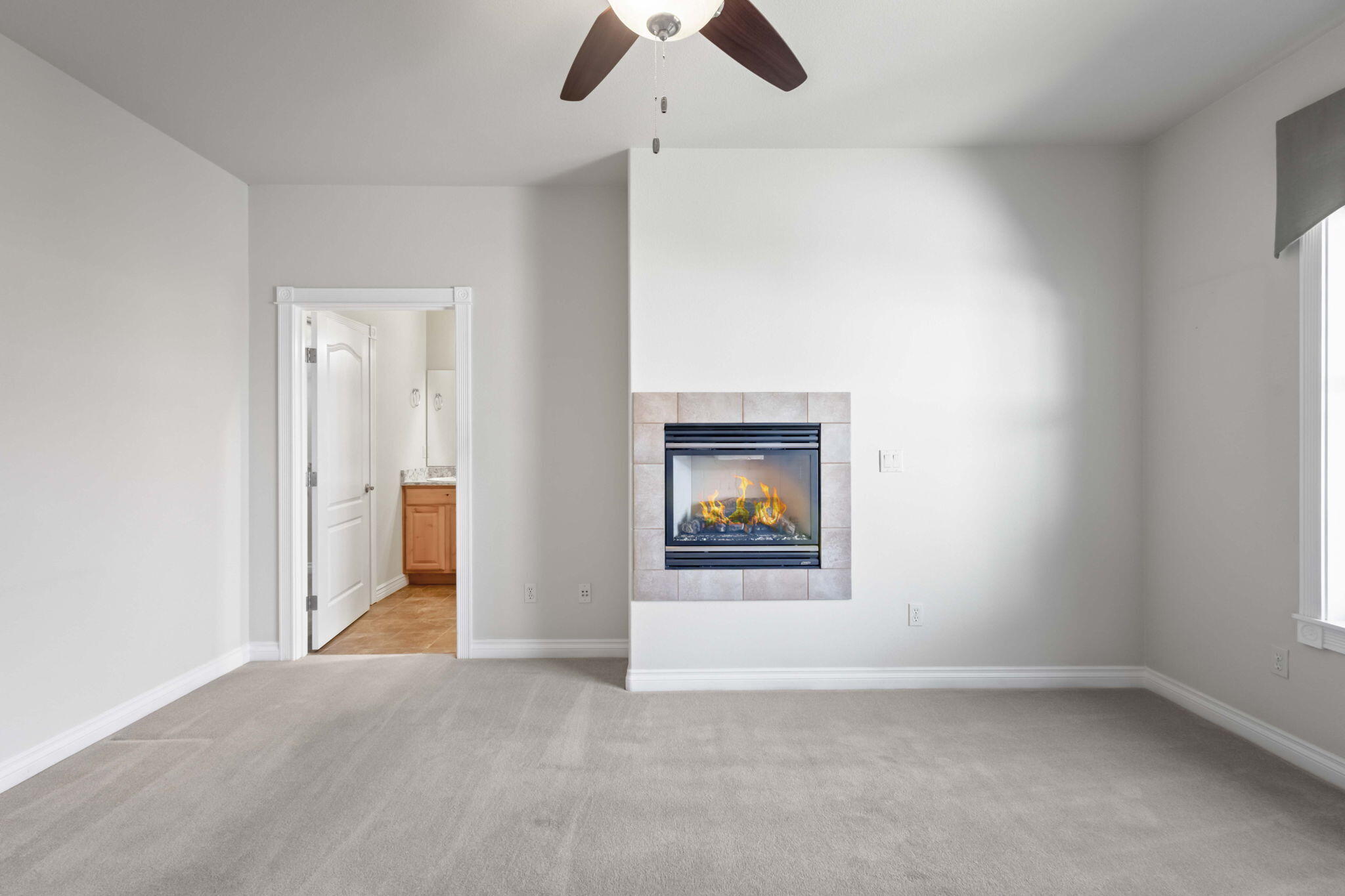 1726 Northwest Cliffside Way Redmond, OR 97756 - Photo 18 of 36 an empty room with ceiling fan and window