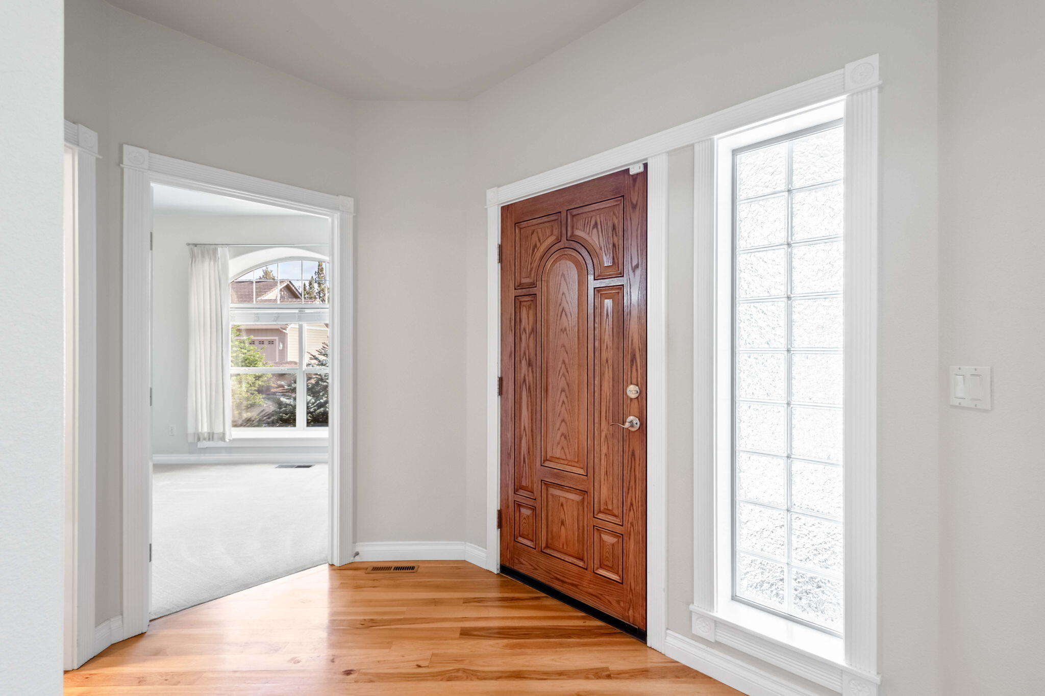 1726 Northwest Cliffside Way Redmond, OR 97756 - Photo 4 of 36 a view of an entryway with wooden floor and door