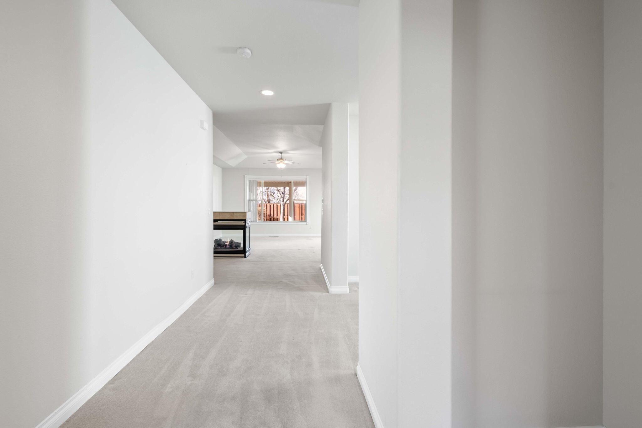 1726 Northwest Cliffside Way Redmond, OR 97756 - Photo 5 of 36 a view of a hallway with a couch and a bathroom