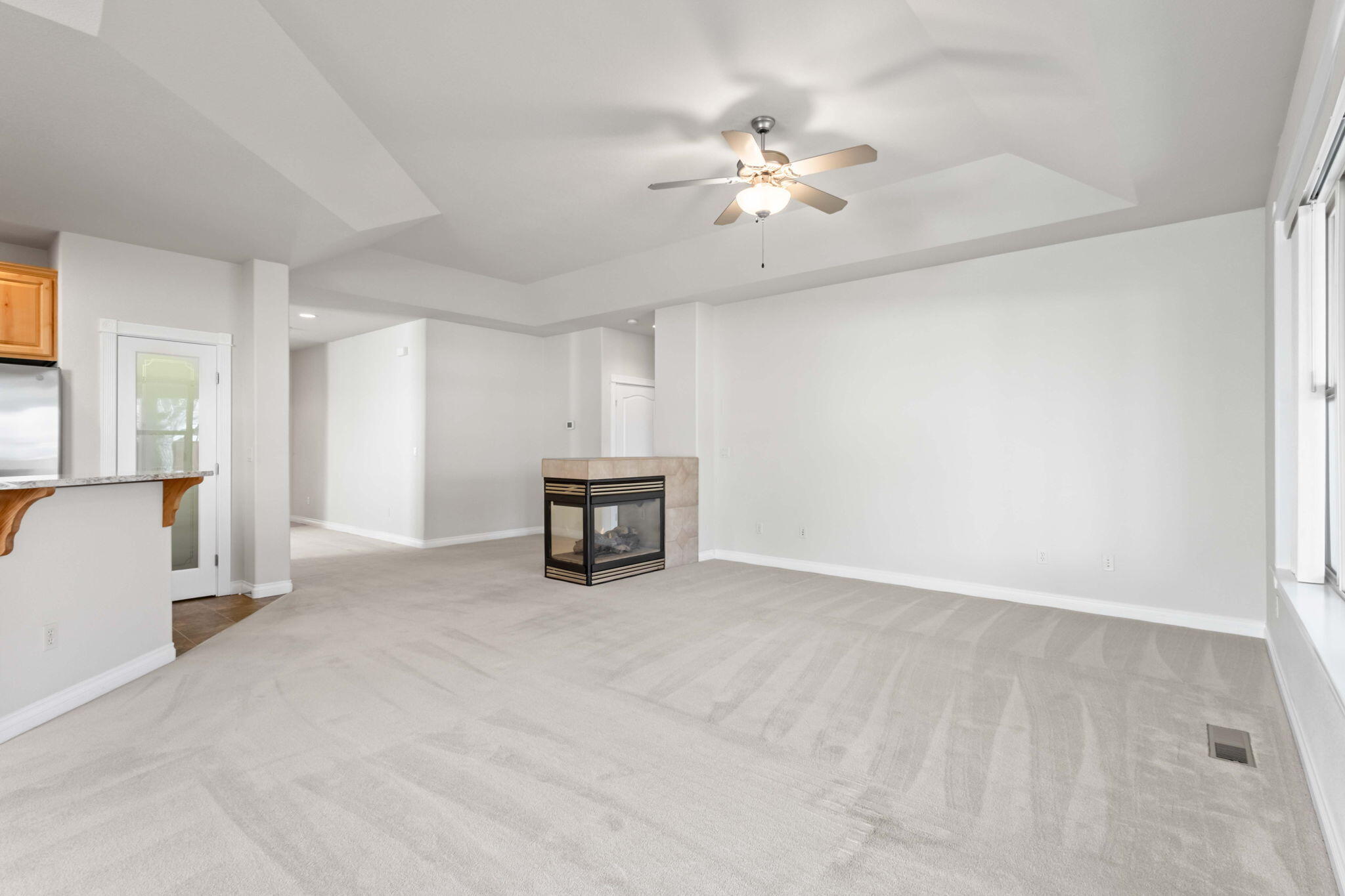 1726 Northwest Cliffside Way Redmond, OR 97756 - Photo 8 of 36 a view of an empty room with a chandelier fan