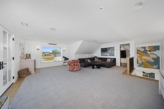 93 Kimball Beach Road Hingham, MA 02043 - Photo 21 of 36 a view of a livingroom with furniture and a flat screen tv