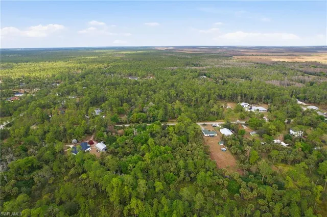 an aerial view of a house with outdoor space