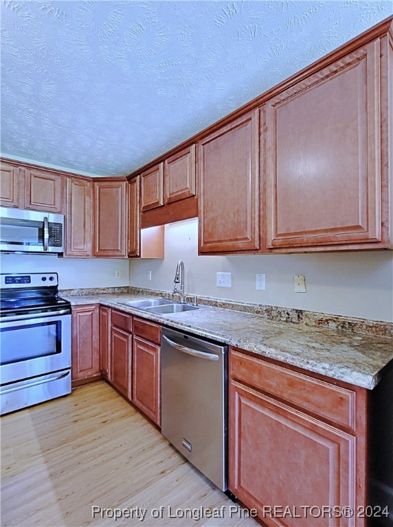 235 Chestnut Drive Raeford, NC 28376 - Photo 19 of 50 a kitchen with stainless steel appliances granite countertop a sink stove and microwave