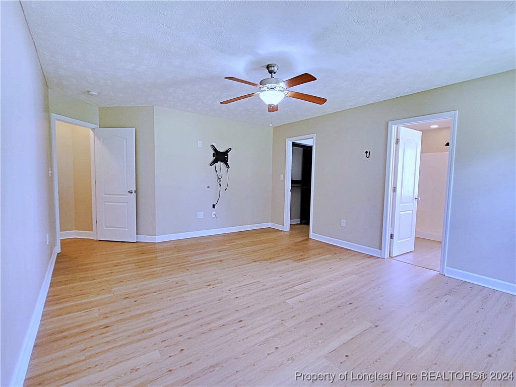 235 Chestnut Drive Raeford, NC 28376 - Photo 24 of 50 a view of empty room with wooden floor
