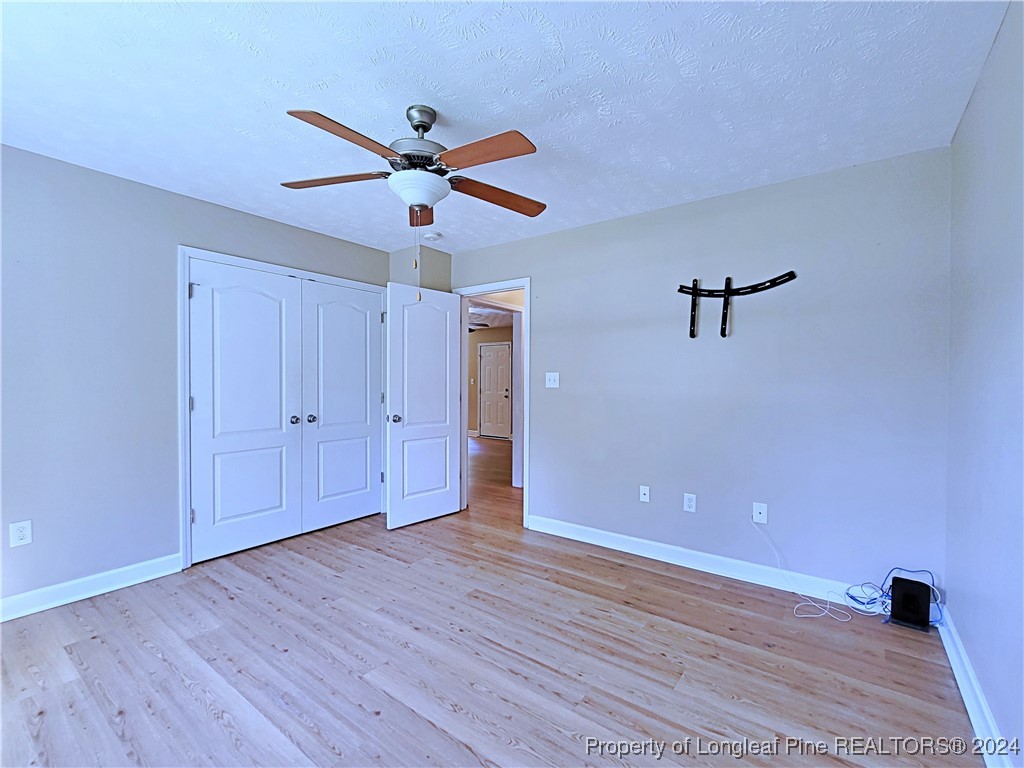 235 Chestnut Drive Raeford, NC 28376 - Photo 35 of 50 a view of an empty room with wooden floor