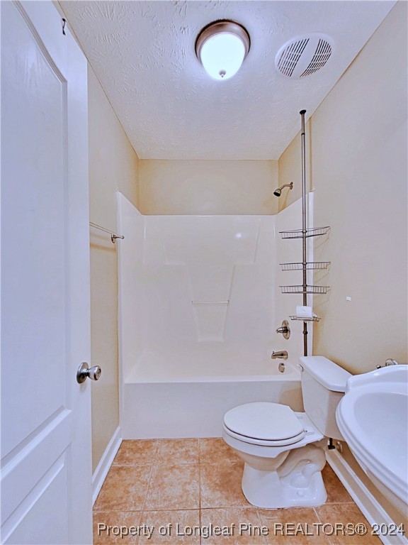 235 Chestnut Drive Raeford, NC 28376 - Photo 37 of 50 a bathroom with a toilet a sink and bathtub