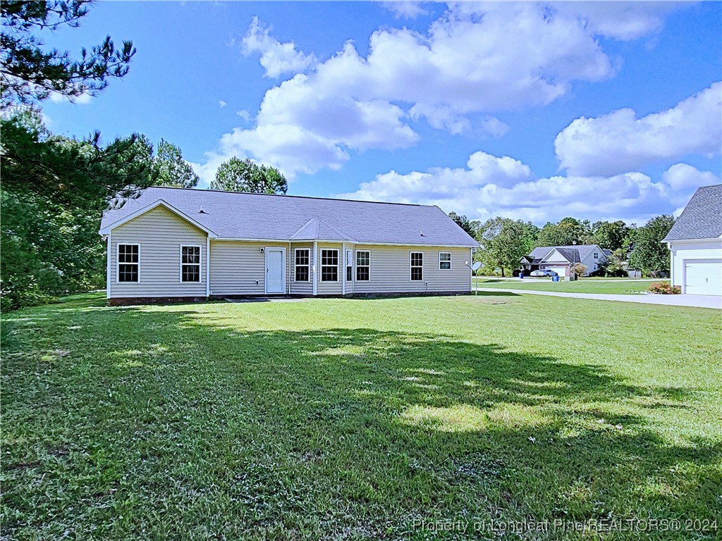 235 Chestnut Drive Raeford, NC 28376 - Photo 48 of 50 a front view of a house with garden