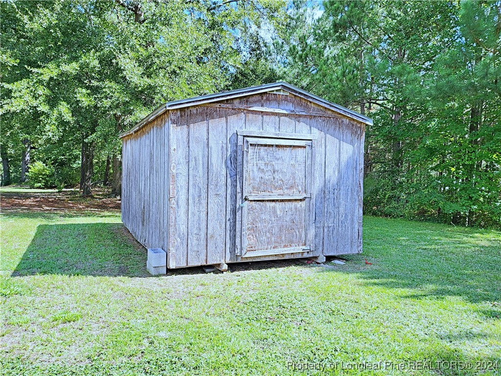 235 Chestnut Drive Raeford, NC 28376 - Photo 50 of 50 a front view of a house with garden
