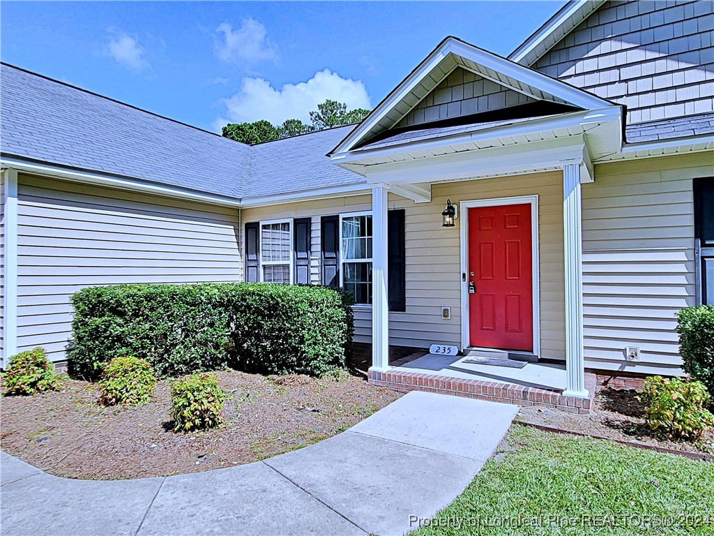 235 Chestnut Drive Raeford, NC 28376 - Photo 5 of 50 a front view of a house with garden