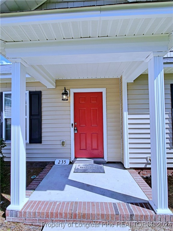 235 Chestnut Drive Raeford, NC 28376 - Photo 6 of 50 a front view of a house with a white door