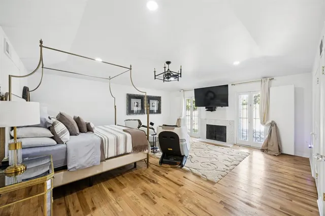 a living room with furniture a couch and a flat screen tv