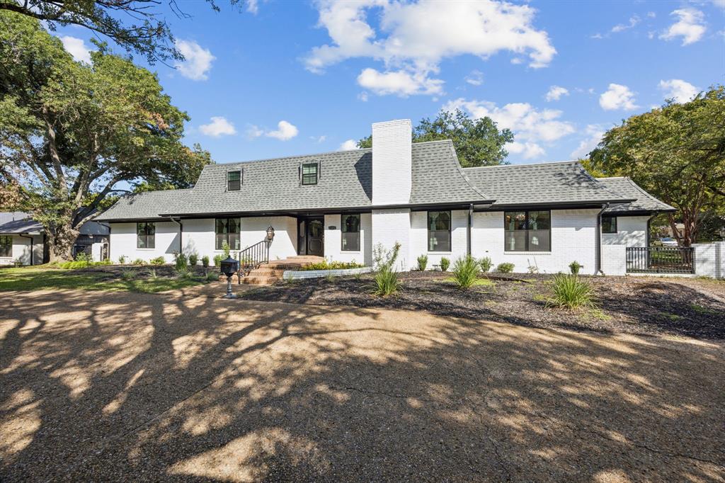11212 Inwood Road Dallas, TX 75229 - Photo 2 of 36 a view of a yard in front of a house