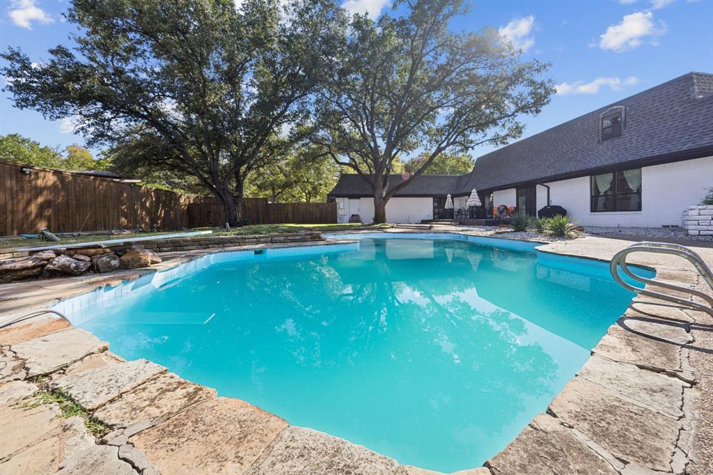 11212 Inwood Road Dallas, TX 75229 - Photo 34 of 36 a swimming pool with outdoor seating and yard