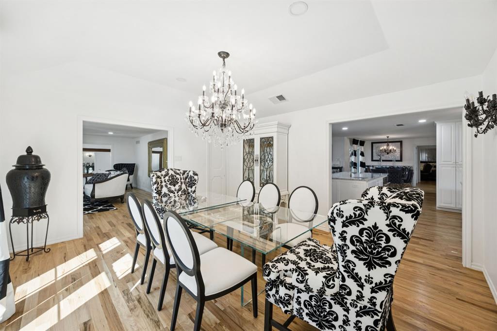 11212 Inwood Road Dallas, TX 75229 - Photo 9 of 36 a view of a dining room with furniture and chandelier